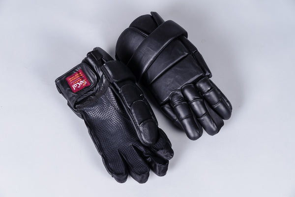 Padded lacrosse style gloves, right glove palm down left glove palm up on grey background